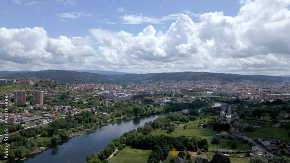 Aerial reverse dolly over Ourense town in Spain and calm mino river Aerial reverse dolly over Ourense town in Spain and calm mino river