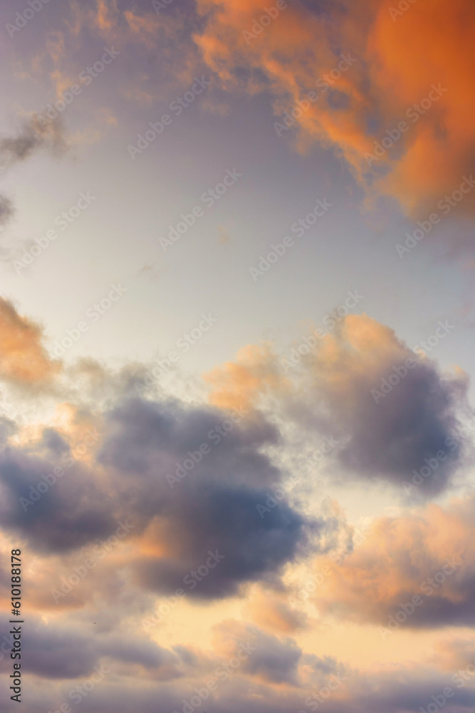 evening sky in orange glow. huge fluffy clouds. dramatic natural background