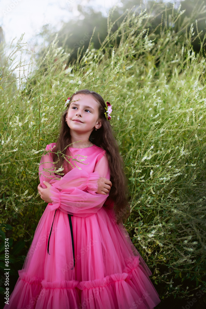 Little girl in pink dress in field Little girl in pink dress in field