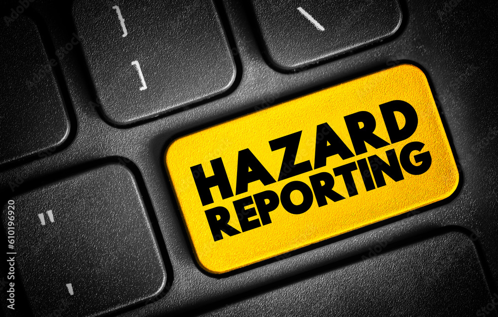 Fototapeta premium Hazard Reporting - written document that contains all possible hazards in a workplace, safety measures, and ways to counter the hazards, text button on keyboard