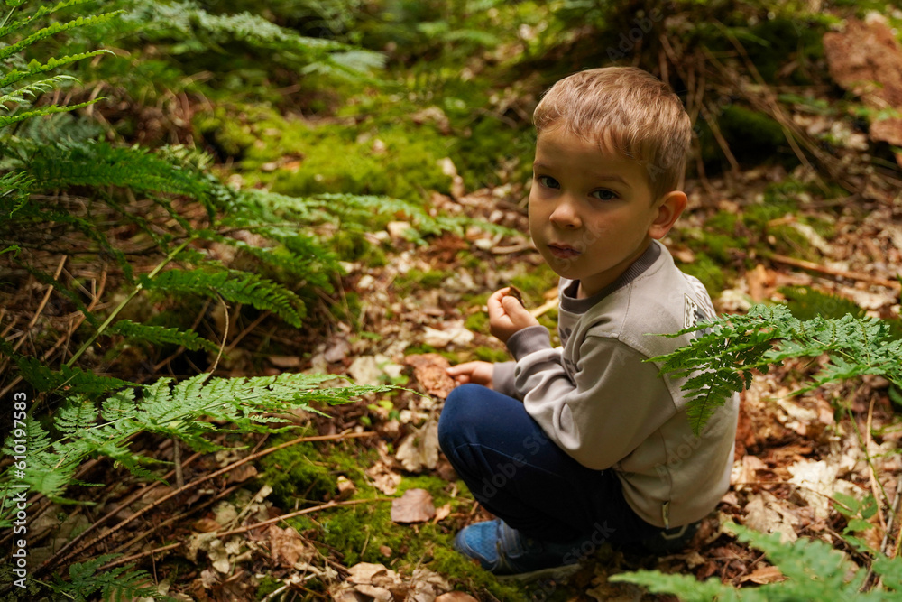 Lonely boy sitting in the woods, lost sad child. Lonely boy sitting in the woods, lost sad child.