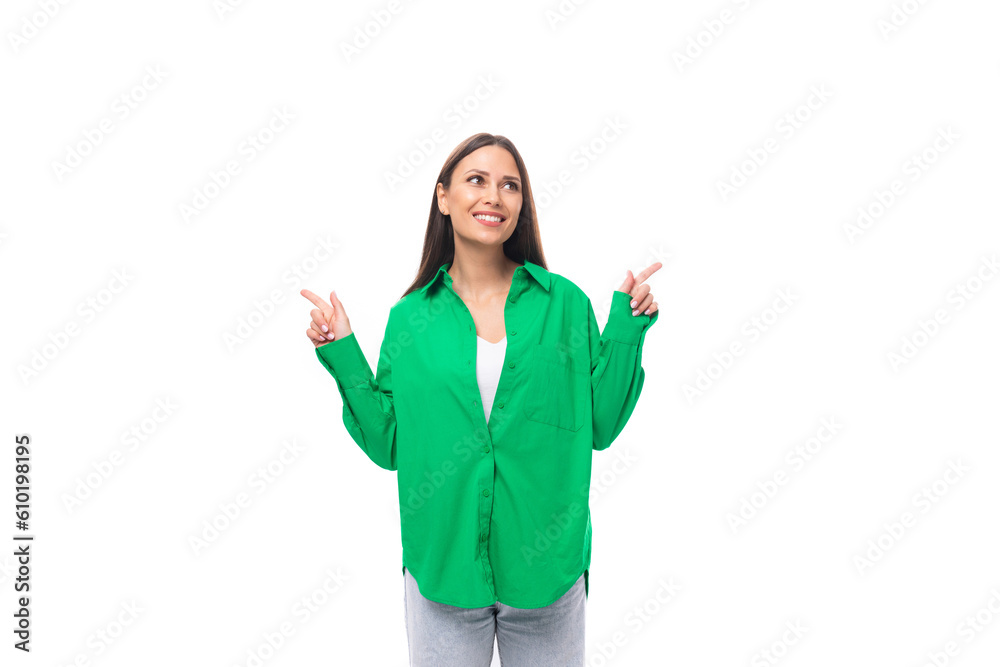 positive slim european young brunette woman with makeup in green shirt on white background with copy space positive slim european young brunette woman with makeup in green shirt on white background with copy space