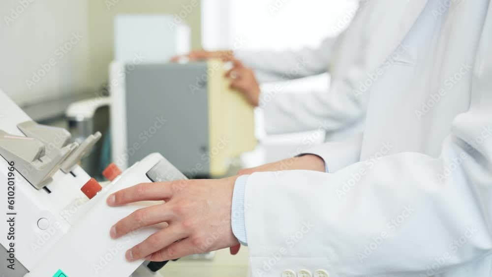 Group of researcher using experimental equipment. Group of researcher using experimental equipment.