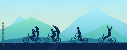 Groups of children ride bicycles in the mountain having fun in summer time vacation.