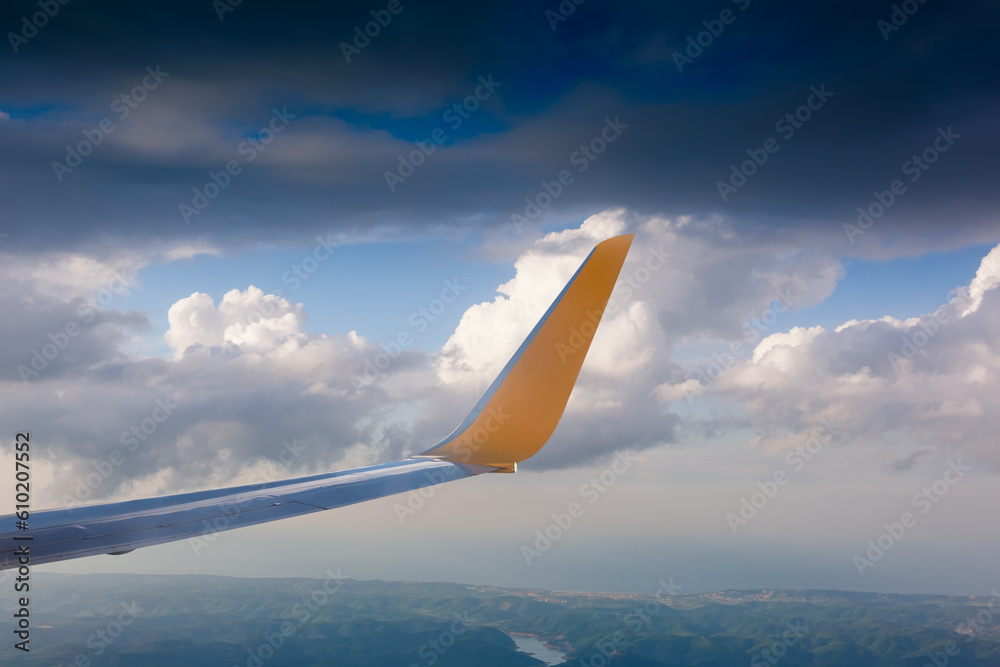 Wing of an airplane in the sunset Wing of an airplane in the sunset