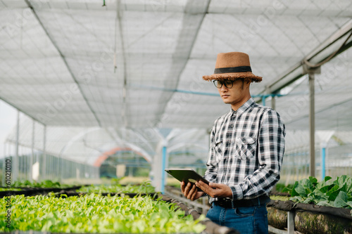 Agriculture technology farmer woman holding tablet or tablet technology to research about agriculture problems analysis data and visual icon.Smart farming .