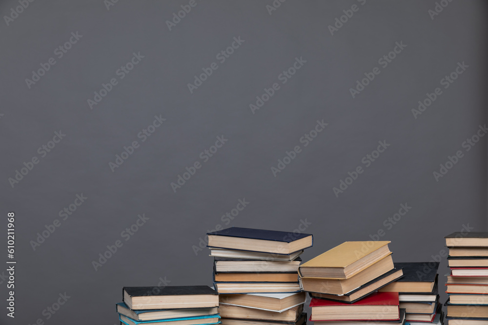 education science stack of books in the library on a gray background education science stack of books in the library on a gray background
