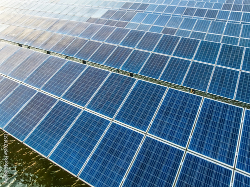 Neatly arranged solar panels at a solar power station in water