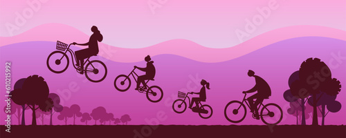 Happy families ride bicycles happily and fly through the air at dusk scenery.
