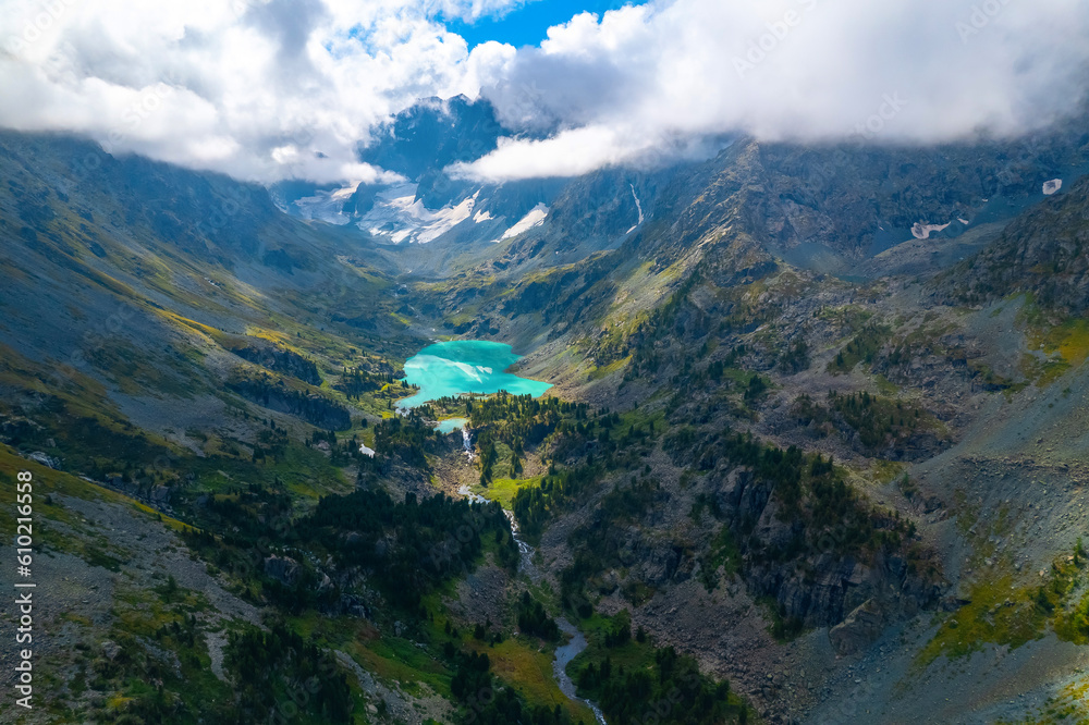 Amazing nature landscape turquoise Kuyguk waterfall and Kuiguk lake in Altai mountains, Siberia Russia. Aerial top view Amazing nature landscape turquoise Kuyguk waterfall and Kuiguk lake in Altai mountains, Siberia Russia. Aerial top view