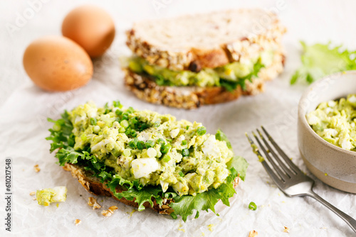 Healthy breakfast toast with avocado egg salad.