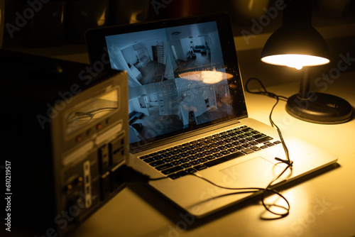 Portable power station charging gadgets on table in room.