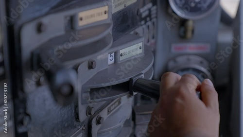 4K footage from driver control console of a locomotive. Engineer gearing throttle handle in compartment of moving train stock video. 