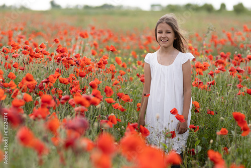 A girl in a poppy field