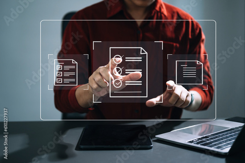 E-document management Paperless workplace, e-signing, electronic signature, document management. businessman signs an electronic document on a virtual notebook screen using a stylus pencil. .
