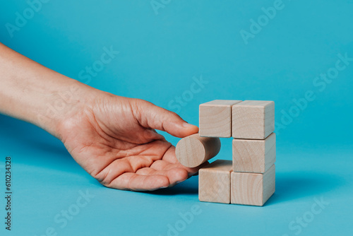 man is playing with building blocks photo