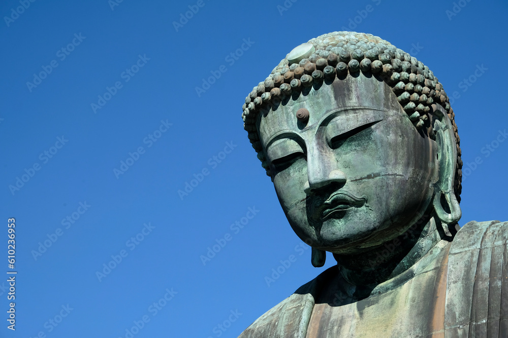 Giant buddha in Kamakura, Japan, against the blue sky
