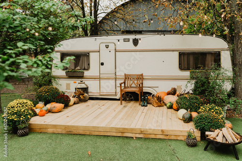 Trailer decorated with pumpkins. Trailer in the fall.