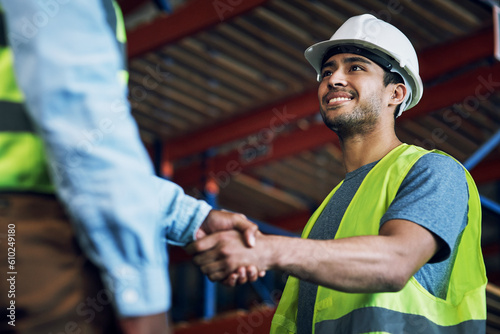 Happy man, architect and handshake for construction, building or hiring in teamwork or partnership on site. Business people shaking hands in recruiting, architecture agreement or contractor deal