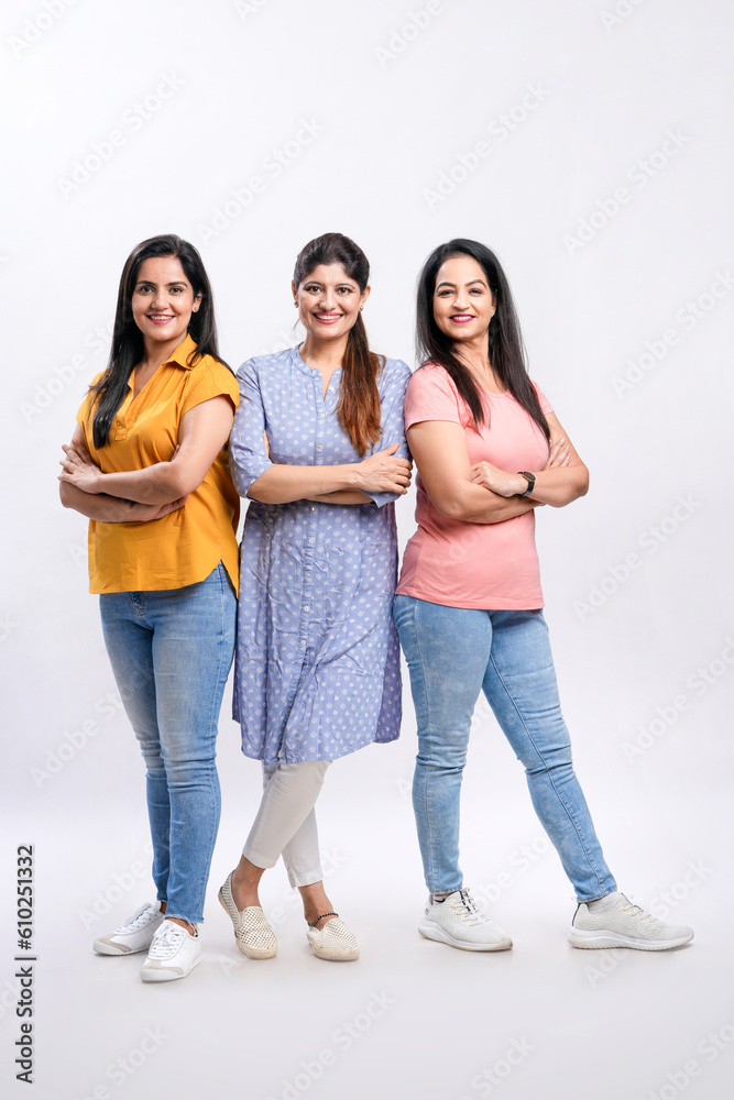 Three indian women giving expression together on white background.