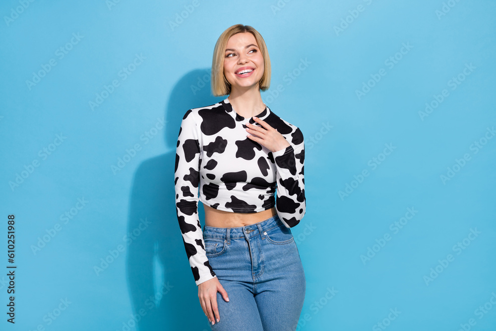 Photo of young girlfriend wear dalmatian crop top preppy posing shopping look empty space brand isolated on blue color background Photo of young girlfriend wear dalmatian crop top preppy posing shopping look empty space brand isolated on blue color background