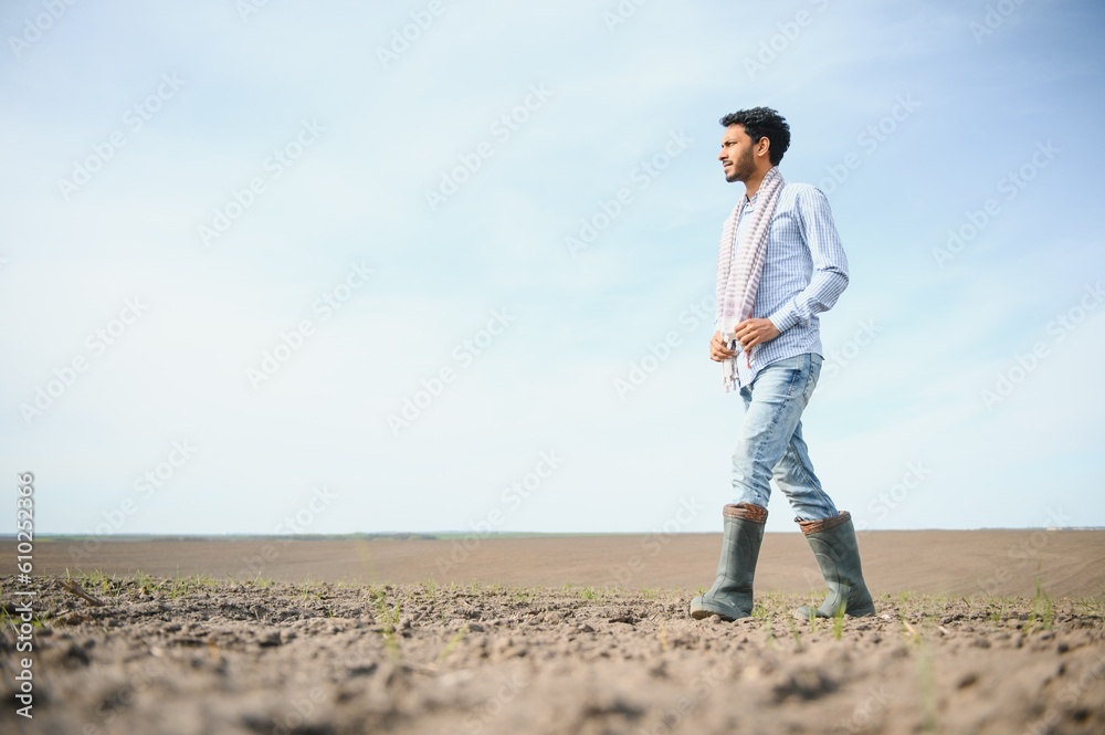 Young Indian farmer in his field