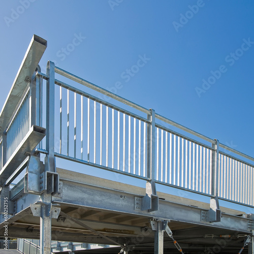 Detail of a new prefabricated railing structure, steel carpentry with pillars, steel beams and galvanized steel bolts