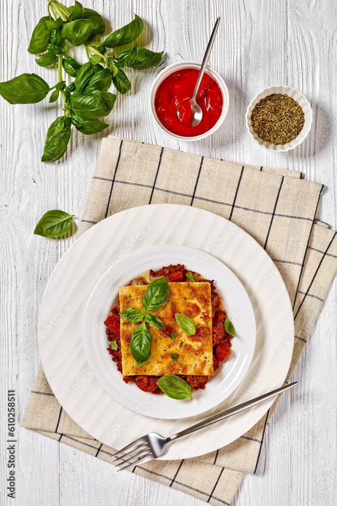 portion of upside down pizza on white plate portion of upside down pizza on white plate