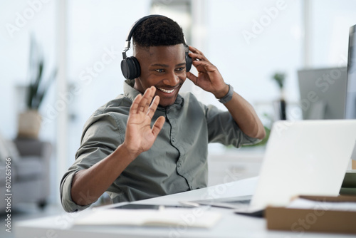 Happy black man, laptop and video call with headphones for webinar, virtual meeting or introduction at the office. Friendly African male person, consultant or agent smiling with headset for seminar