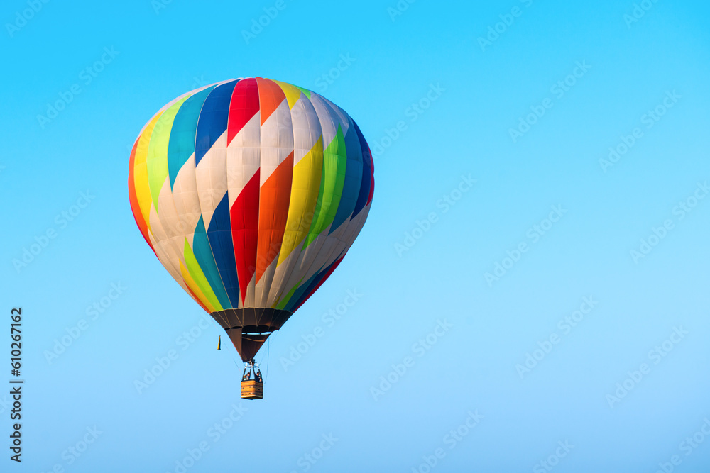 Fototapeta premium Hot air balloon is flying in the sky at the morning