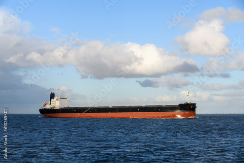 Bulk carrier vessel. View from side. Bulker. Dry cargo ship.