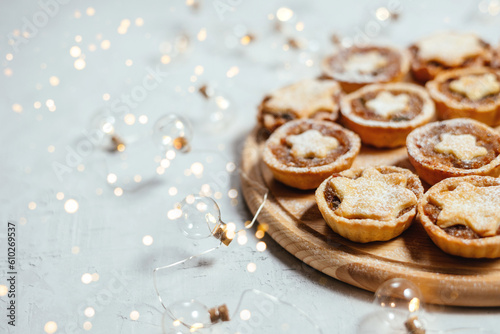 Christmas mince pies with fruit filling on a gray background.