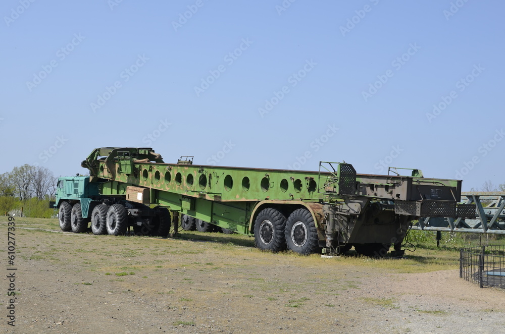 An old Soviet installer of an intercontinental ballistic missile into a silo launcher. Military tractor MAZ-537. Side view An old Soviet installer of an intercontinental ballistic missile into a silo launcher. Military tractor MAZ-537. Side view