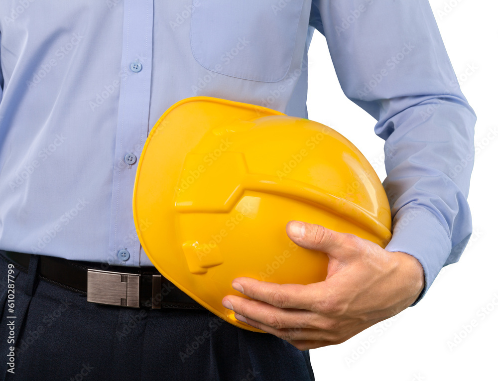 Male foreman holding a hardhat on the construction site Male foreman holding a hardhat on the construction site