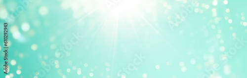 Abstract blue green bokeh background - Christmas  Summer or spring concept - Blurred bokeh lights with sunbeams 