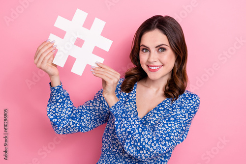 Portrait of nice positive girl arms hold paper hashtag symbol card isolated on p Fototapet