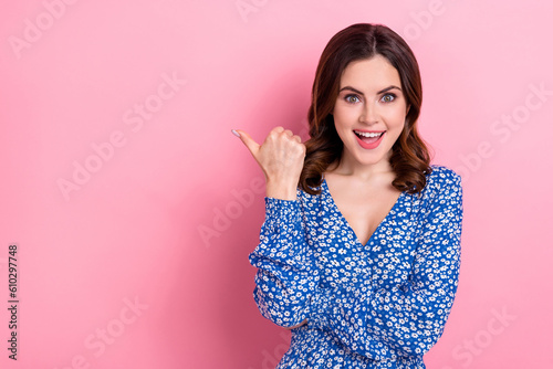 Fotografiet Portrait of astonished overjoyed cute girl wear blue clothes directing at sale e