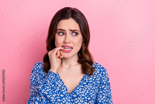 Portrait of worried stressed frightened pretty girl wear blue clothes biting fin Fototapet