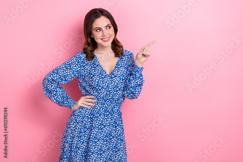 Portrait of pretty positive person look indicate finger empty space offer isolat Fototapet