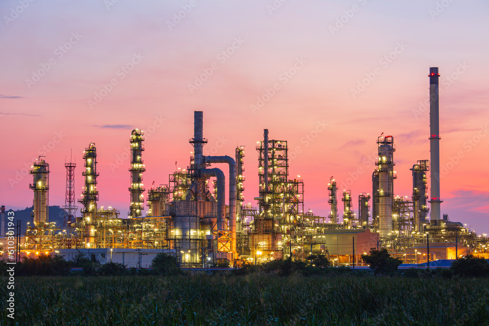 Oil​ refinery​ and​  plant and tower column of Petrochemistry industry in oil​ and​ gas​ ​industrial with​ cloud​ red sky