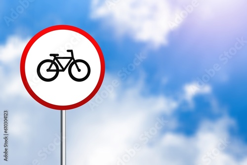 Round bicycle red sign on sky background.