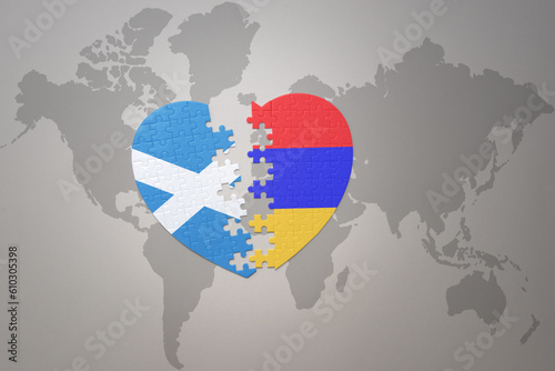 puzzle heart with the national flag of armenia and scotland on a world map background.Concept.