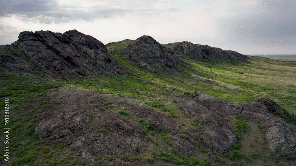 The Kazakh Uplands include mountain ranges of moderate altitude separated by elevated flat intermontane basins. Karaganda Region, Kazakhstan. The Kazakh Uplands include mountain ranges of moderate altitude separated by elevated flat intermontane basins. Karaganda Region, Kazakhstan.