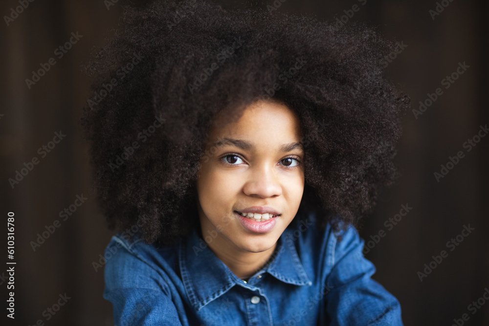 Friendly smiling girl with afro hair Friendly smiling girl with afro hair