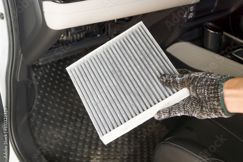 Auto mechanic replace car cabin air filter, Car maintenance service.
