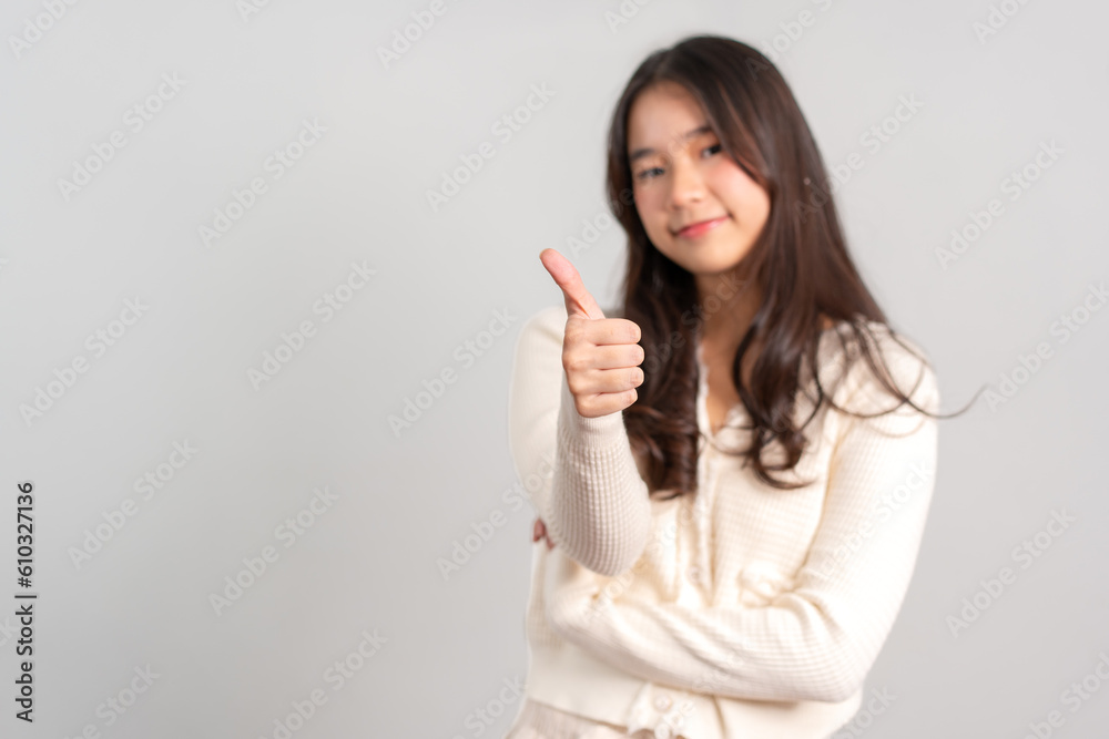 Portrait of attractive cheerful girl demonstrating and pointing finger to the side empty space isolated white background, showing advertisement, standing against. Advertisement & presentation concept Portrait of attractive cheerful girl demonstrating and pointing finger to the side empty space isolated white background, showing advertisement, standing against. Advertisement & presentation concept