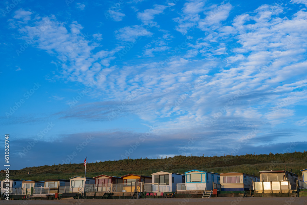 A row of small beach huts in the evening at Egmond aan Zee/NL