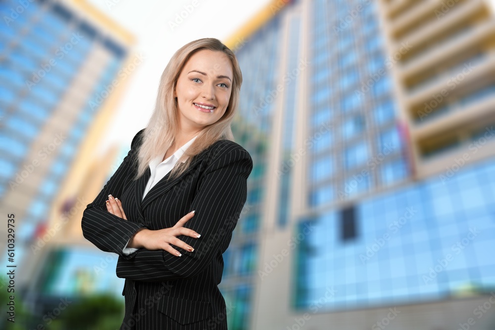 Fototapeta premium Young happy business woman in busy street