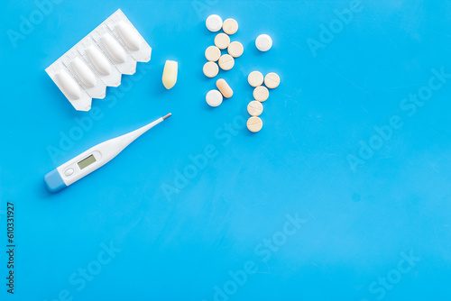 Pharmaceuticals for medical treatment with thermometer and pills