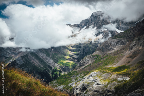 Sunlight into clouds in the mountain with a waterfall